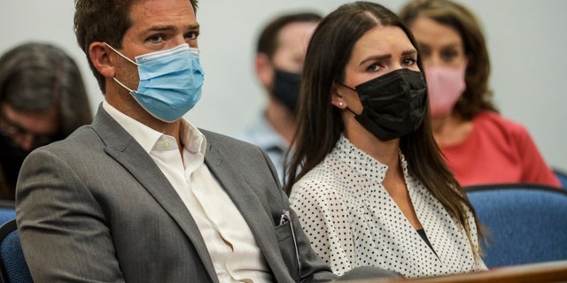 Dr. Grant Robichaux and Cerissa Riley wear face masks in court
