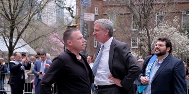 De Blasio talks outside with head of security Howard Redmond