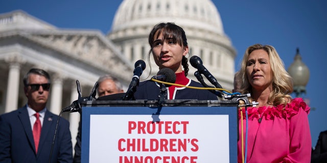 Chloe Cole stands before the Capitol building