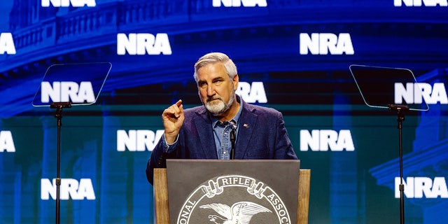 Eric Holcomb on NRA stage