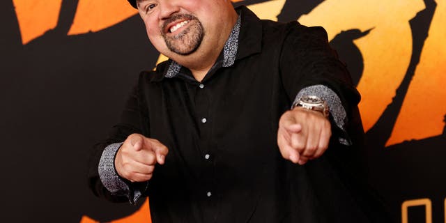 Gabriel Iglesias smiling and pointing at the camera
