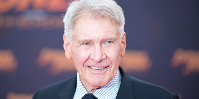 Harrison Ford smiles on the red carpet for "Indiana Jones"