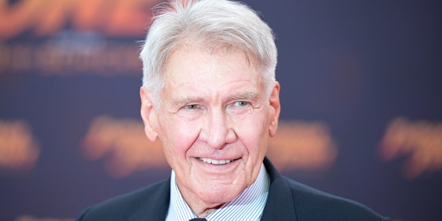 Harrison Ford smiles on the red carpet for "Indiana Jones"