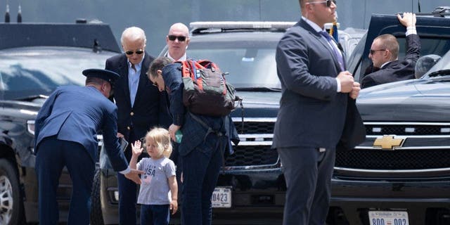 Beau Biden is greeted before boarding Marine One