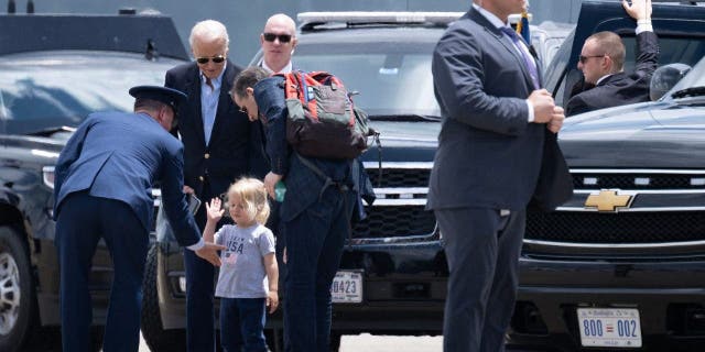 Beau Biden is greeted before boarding Marine One