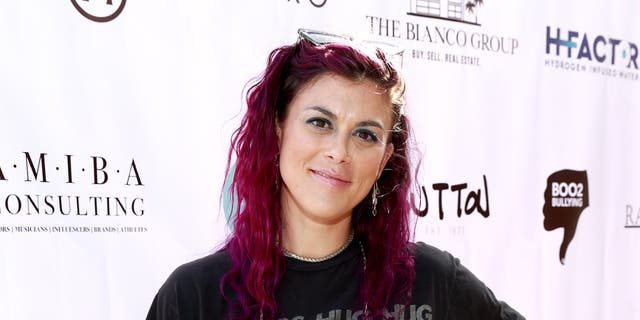 Lindsey Shaw with bright pink hair