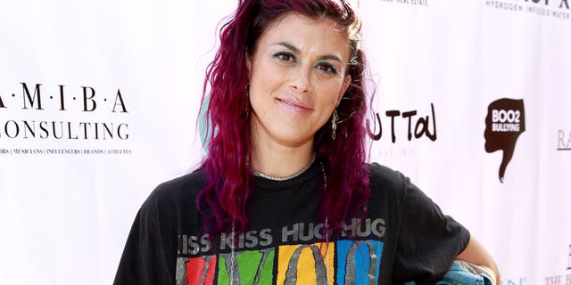 Lindsey Shaw with bright pink hair