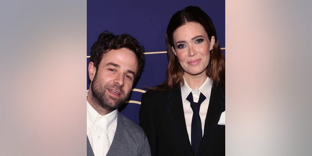 Taylor Goldsmith leans into wife Mandy Moore on the carpet