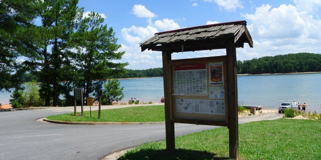 A sign by the lake