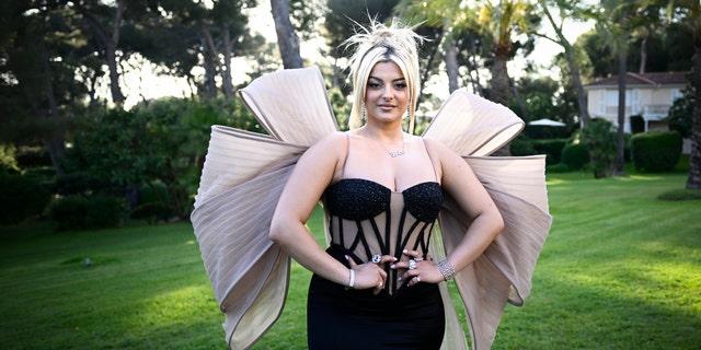 Bebe Rexha in a black gown with huge tulle wings at Cannes