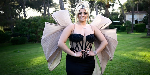 Bebe Rexha in a black gown with huge tulle wings at Cannes