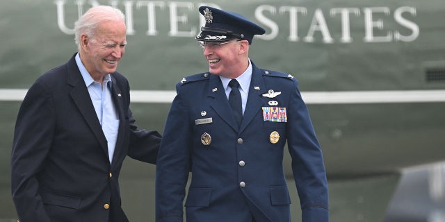 Biden walks to board Air Force One to depart for the UK