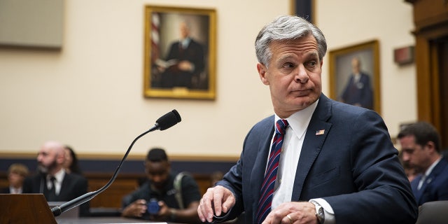 Chris Wray prepares to be questioned by the House Judiciary Committee