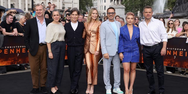 Christopher Nolan, Emma Thomas, Cillian Murphy, Emily Blunt, Robert Downey Jr., Florence Pugh and Matt Damon pose for a photo at the London premiere of their movie "Oppenheimer"