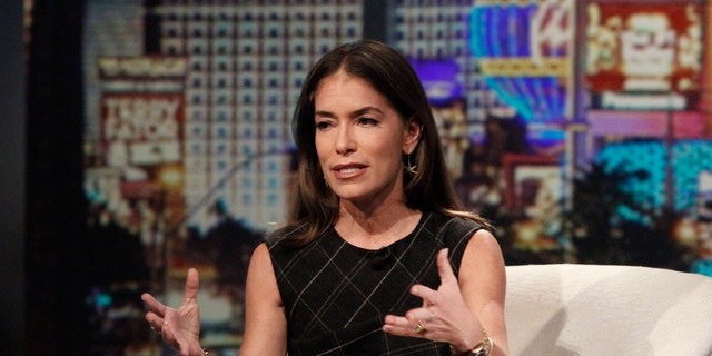 Laura Wasser sitting in a chair and talking with her hands