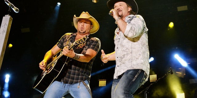 Jason Aldean and Travis Tritt perform on stage in Tennessee