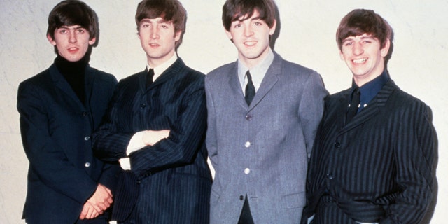 The Beatles, George Harrison, John Lennon, Paul McCartney and Ringo Starr pose for a photo around 1965