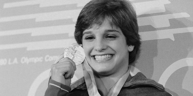 Mary Lou Retton with her gold medal