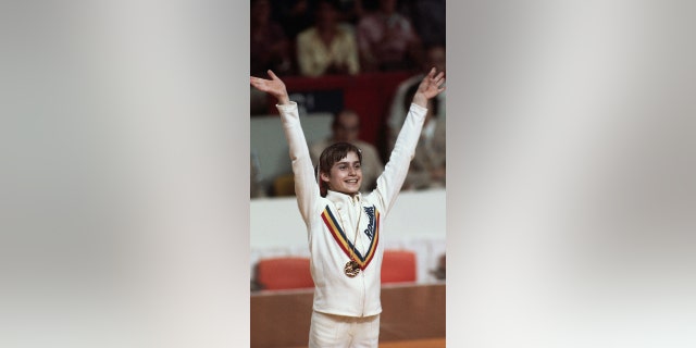 Nadia Comaneci smiling with medal