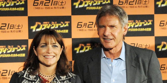 Karen Allen and Harrison Ford posing together