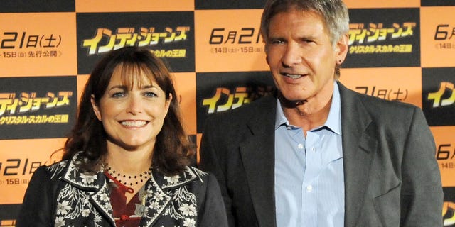 Karen Allen and Harrison Ford posing together