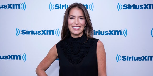 Laura Wasser poses with hand on her hip