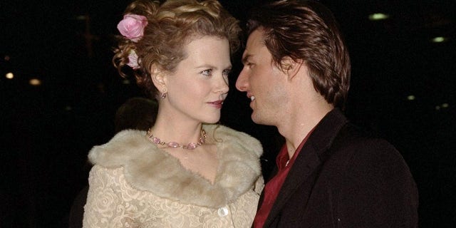 An old photo of Nicole Kidman and Tom Cruise cozied up together.