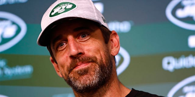 Aaron Rodgers speaks to the media
