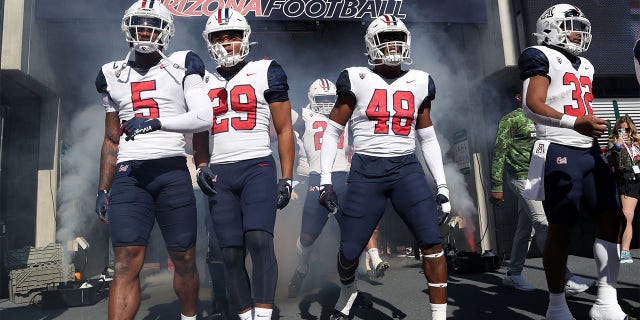 The Arizona Wildcats take the field before a game against Washington State