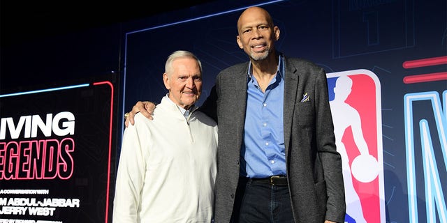 Kareem Abdul-Jabbar and Jerry West pose for a picture
