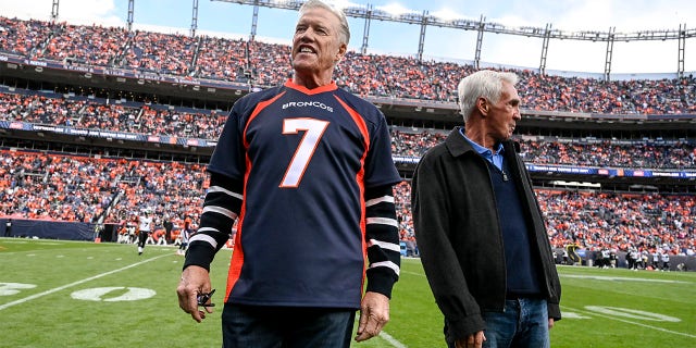 Denver Broncos John Elway stands on the field on 2022