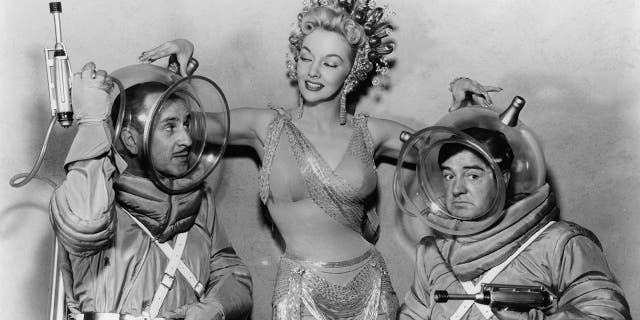 Mari Blanchard in a glamorous costume in the center of Abbott and Costello in scuba gear