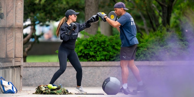 Brooks Nader wearing working gear while sparring outside