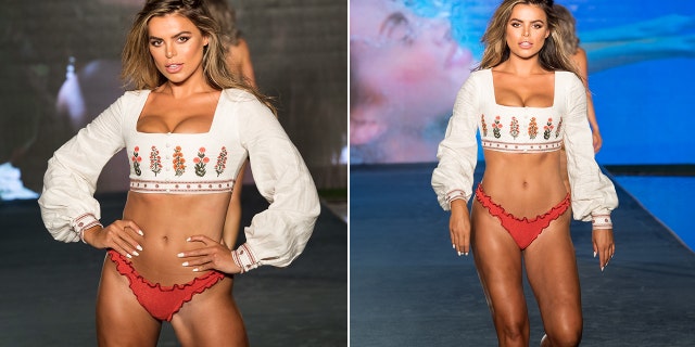 Brooks Nader wearing a white top and a red bikini bottom