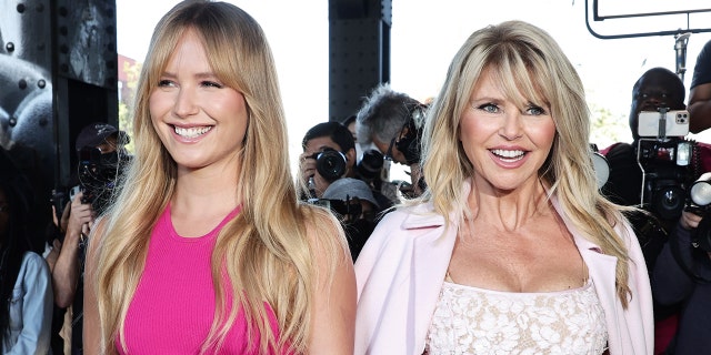 Christie Brinkley and her daughter Sailor Brinkley Cook wearing pink dresses of various shades
