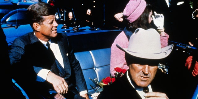 JFK and Jackie Kennedy sitting next to each other in Texas before the president was assassinated