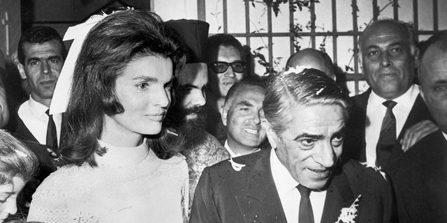 Jackie Kennedy in a bridal gown marrying aristotle onassis