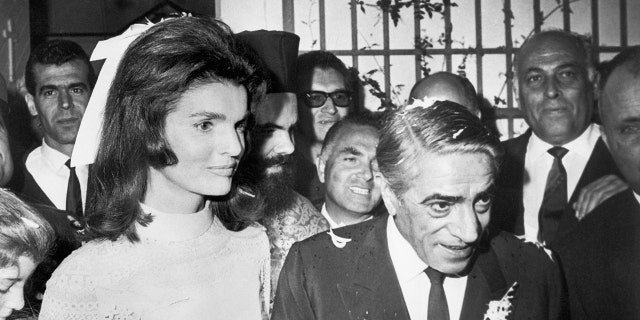 Jackie Kennedy in a bridal gown marrying aristotle onassis