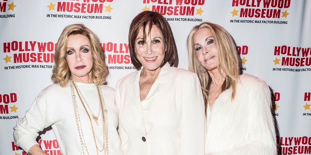 Donna Mills, Michele Lee and Joan Van Ark all wearing white suits