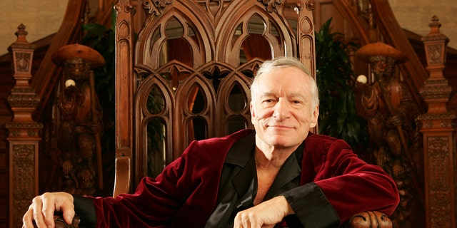 A close-up of Hugh Hefner wearing his red robe
