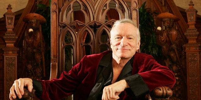A close-up of Hugh Hefner wearing his red robe