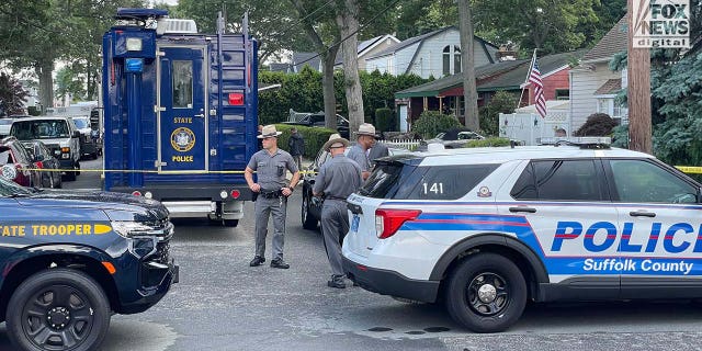 Suffolk County police stationed outside of a home in Massapequa Park