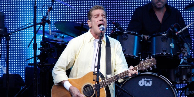 Glenn Frey singing and playing guitar