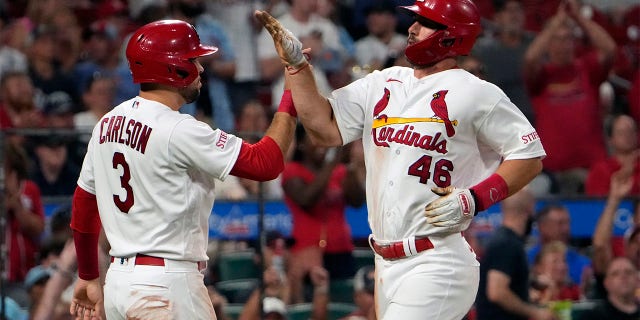 Paul Goldschmidt and Dylan Carlson celebrate