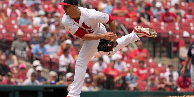 Jack Flaherty throws pitch