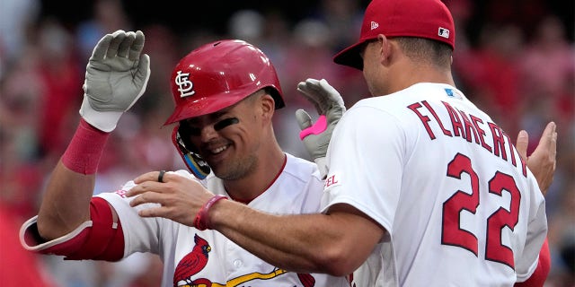 Lars Nootbaar is congratulated by Jack Flaherty