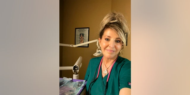 A close-up of Janet Gardner as a dental hygienist