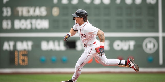 Jarren Duran runs after a basehit