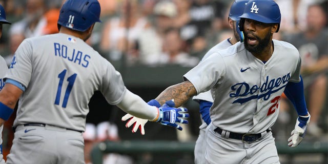 Jason Heyward celebrates with Miguel Rojas