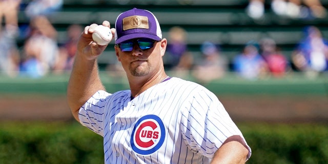 Jim Foster throws a ceremonial first pitch